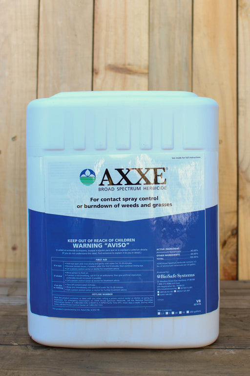 A large white plastic jug of AXXE Broad Spectrum Herbicide with a blue and white label, set against a rustic wooden plank background.