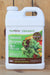 A white plastic jug of AgroThrive Organic General Purpose Liquid Fertilizer, featuring a green and brown label with an illustration of fresh vegetables, set against a rustic wooden background.