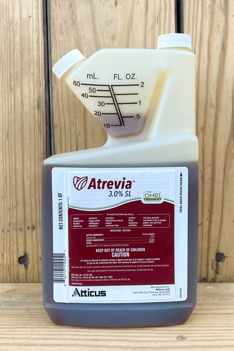 A 3.0 L bottle of Atrevia Atticus 3.0% SL with a measuring jug attachment, set against a wooden plank background.