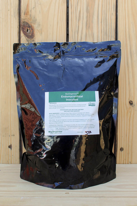 A stand-up pouch of BioOrganics Endomycorrhizal Inoculant, featuring a shiny black and blue reflective bag with a white and green label, set against a light wood plank background.