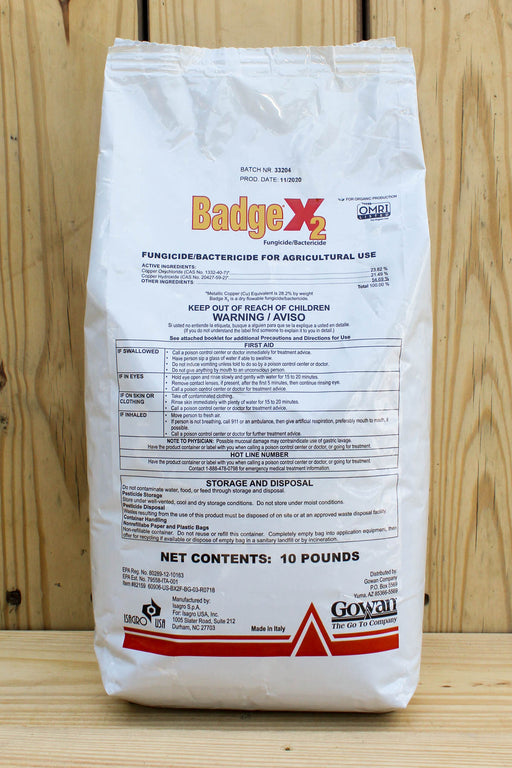 A 10-pound white bag of Gowan BadgeX2 fungicide and bactericide, displayed against a light wood panel background.