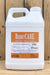 A 2.5 gallon white plastic jug of AEF Global BerryCare Fungicide and Bactericide Concentrate, featuring an orange and white label, set against a rustic wooden plank background.
