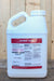A large white plastic jug of Biomin Iron liquid fertilizer with a white cap, set against a rustic wooden plank background.
