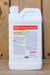 A white plastic bottle of BRANDT Organics Defoamer with a white cap, standing on a wooden surface against a wooden plank background. The label features red and black text and logos, including the prominent BRANDT logo.