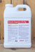 A large white plastic jug of Brandt Organics 4% Mg liquid fertilizer, standing upright against a rustic wooden plank background.
