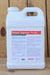 A large white plastic jug of Brandt Organics 7% Zn liquid fertilizer, featuring a detailed white label with red and green text, set against a rustic wooden plank background.