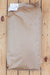 A brown kraft paper bag with a white paper tag attached, placed on a light wood plank surface.
