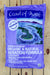 A large purple bag of Coast of Maine Stonington Blend Organic & Natural Aeration Formula soil amendment, displayed flat on a light-colored wooden plank surface.