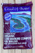 A bag of Coast of Maine Organic Cow Manure Compost Soil Builder, Schoodic Blend, shown on a light-colored wooden plank background. The packaging is dark purple with a central illustration of a winding blue river and green island.