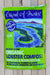 A bag of Coast of Maine Organic Lobster Compost Quoddy Blend, displayed flat on a light-colored wooden plank surface. The packaging is bright lime green with a dark blue landscape illustration of a winding river.