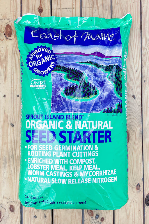 A bag of Coast of Maine Organic & Natural Seed Starter, specifically the Sprout Island Blend, displayed on a light-colored wooden plank background.