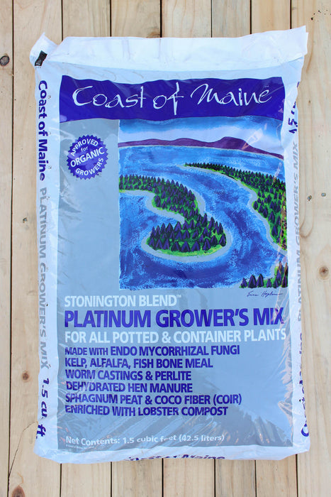 A 1.5 cu ft bag of Coast of Maine Stonington Blend Platinum Grower's Mix for potted and container plants, placed on a light-colored wooden surface.