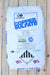 A 50 lb bag of Old Bridge Copper Sulfate fertilizer, featuring a white bag with blue and black text and graphics, placed on a light-colored wooden plank surface.