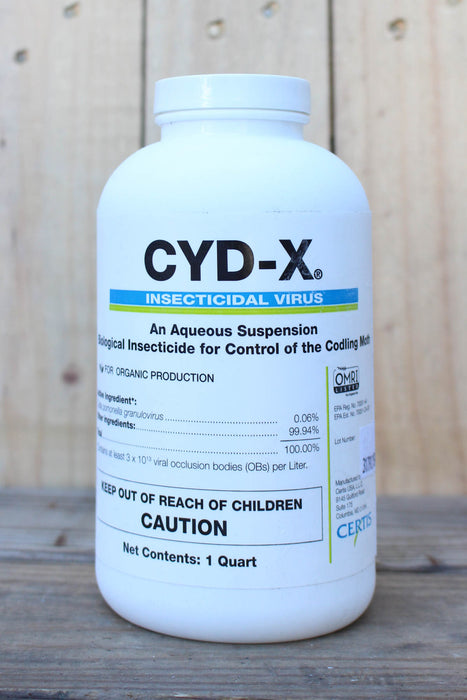 A white plastic bottle of CYD-X Insecticidal Virus, set against a rustic wooden background.