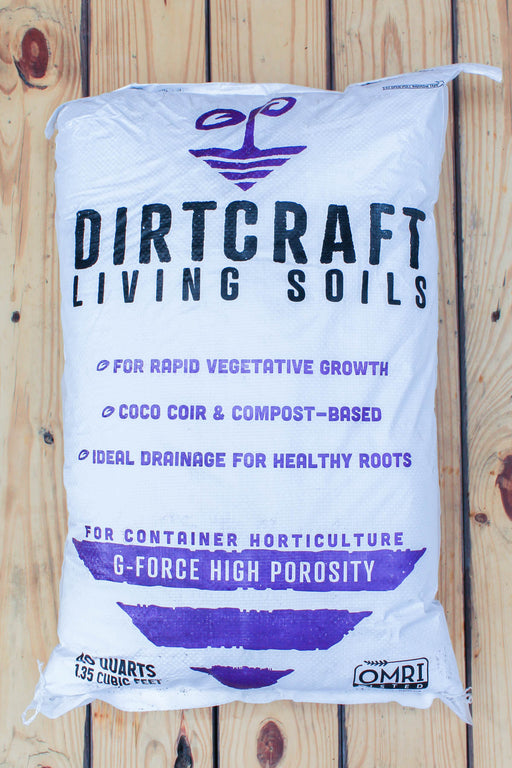 A 45 lbs bag of Dirtcraft Living Soils G-Force High Porosity container horticulture mix, displayed on a light-colored wooden plank background.