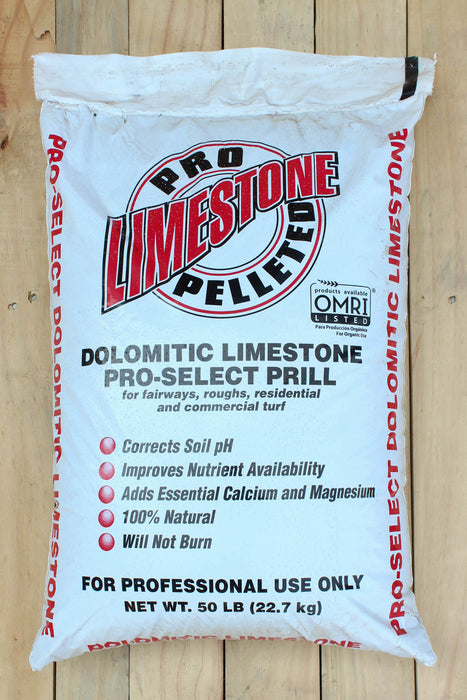 A 50 lb bag of Pro-Limestone Pro-Select Prill dolomitic limestone, displayed flat on a light-colored wooden plank background.