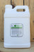 A white plastic jug of ECO Blend Weed & Grass Burndown herbicide standing against a rustic wooden plank background.