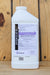 A white plastic bottle of BioWorks Epishield O insecticide and miticide, shown from the back against a rustic wooden plank background.