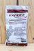 A bag of Exceed Garden Combination Peat inoculant, displayed on a light-colored wooden surface.