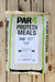A large bag of PAR4 Protein Meals Fish Meal fertilizer placed on a light-colored wooden plank surface. The bag is off-white with green borders and black text, featuring a white label in the center.