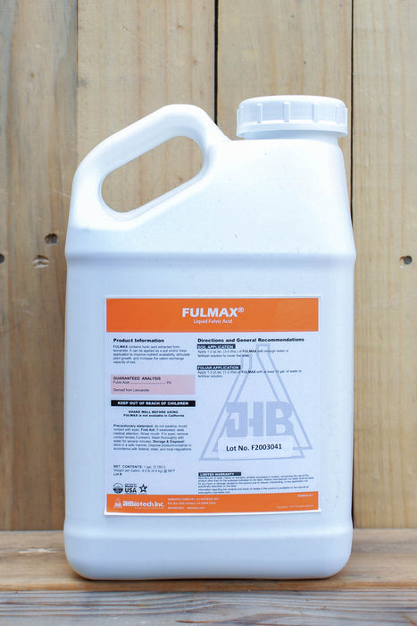A white plastic jug of Fulmax, featuring an orange and white label, set against a rustic wooden plank background.