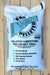 A 50 lb bag of Calcitic Limestone Pro-Pelleted Pro-Select Prill for professional turf care, displayed on a light-colored wooden plank background.
