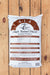 A 40 lb bag of Seven Springs Farm Supply 4-1-4 High Tunnel Blend Natural Fertilizer, displayed flat on a light brown wooden plank background.