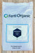 A 50 lb white bag of Ferti-Organic Soluble Humic Acid, displayed flat on a light-colored wooden plank surface. The packaging features the Ferti-Organic brand name and logo, with product details printed at the bottom.