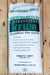 A large white bag of Krum Horticultural Perlite placed on a light brown wooden plank surface. The bag features green and black branding with text detailing its benefits as a natural, lightweight, and aeration-promoting substrate.