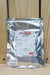 A silver foil pouch of LALSTOP K61 WP by Lallemand, displayed against a light wood panel background.