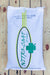 A white bag of Clover Nitro-Coat medium red clover, displayed flat on a light-colored wooden plank surface.