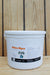 A 5 lbs white plastic bucket of Mikro-Myco, featuring a white label with orange and black text, set against a rustic wooden plank background.