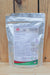 A stand-up pouch of MilAgro Keylamax Organic 4-0-40 Potassium Powder Fertilizer, displayed on a light wood surface against a wooden plank background.