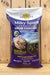 A bag of St. Gabriel Organics Milky Spore Granular Grub Control, displayed on a wooden surface against a wooden plank background.