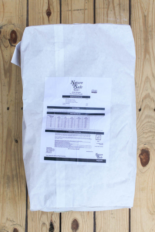 A white paper bag with a printed Nature Safe label, placed on a light-colored wooden plank surface.