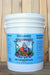 A white plastic bucket of Neptune's Organic Fish & Seaweed Fertilizer, 5 gal, featuring a blue label with a colorful cartoon illustration of Neptune holding a trident, set against a wooden plank background.