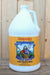 A white plastic gallon jug of Neptune's Harvest Organic Fish Fertilizer with a yellow label, set against a rustic wooden plank background.