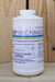 A white plastic bottle of OSO 5% SC Fungicide standing on a wooden surface against a wooden plank background.