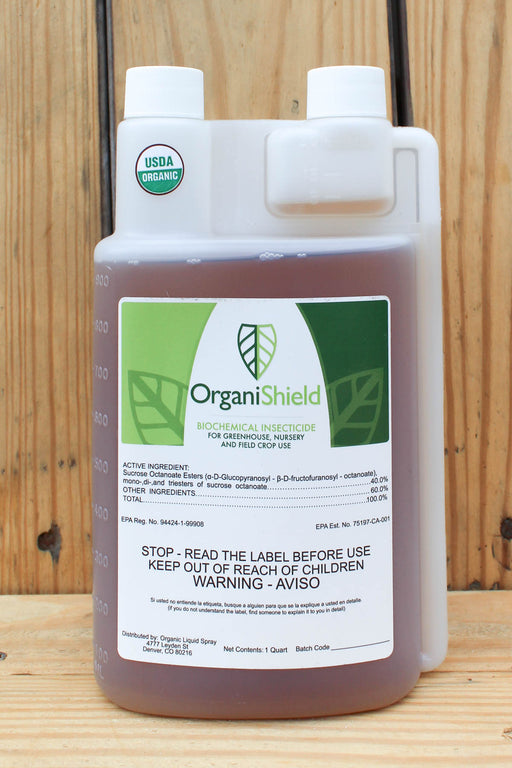 A 1-quart plastic jug of OrganiShield Biochemical Insecticide with a white cap and a white label featuring green leaf graphics, set against a rustic wooden plank background.