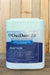 A large white plastic container of OxiDate 2.0 broad spectrum bactericide and fungicide, featuring a blue and white label, set against a vertical wood plank background.