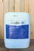 A large white plastic bucket of OxiDate 2.0, featuring a blue and white label, set against a rustic wooden plank background.
