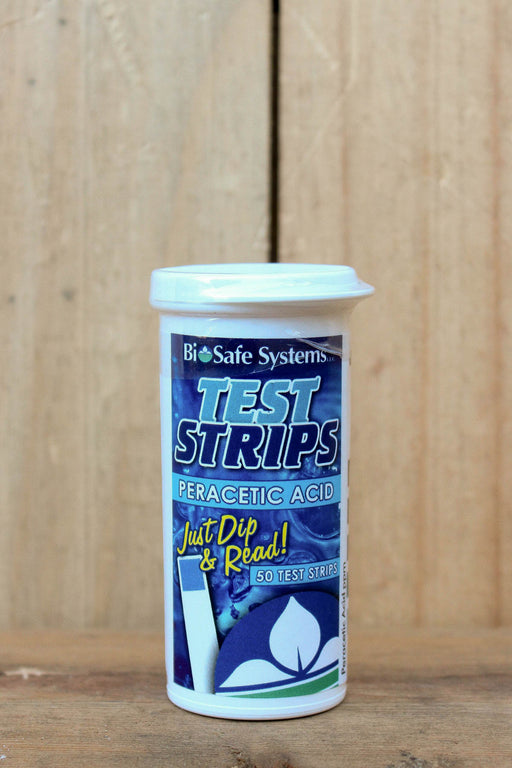 A white plastic container of BioSafe Systems Test Strips for Peracetic Acid, featuring a blue and white label with yellow text, set against a rustic wooden background.