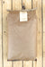 A brown kraft paper bag with a white paper label reading 'Peanut Meal', laid flat on a light wood plank background.