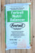 A 60 lb bag of Fertrell Nutri-Balancer livestock feed program supplement, displayed flat on a light-colored wooden plank surface. The bag is white with a prominent green label block and black text.