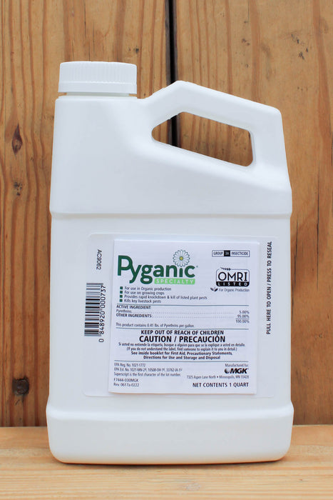 A white plastic jug of Pyganic Specialty with a white cap, set against a vertical wood plank background.