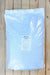 A large white plastic bag of Ida-Gro Potassium Phosphate 0-3-0 fertilizer, placed flat on a light-colored wooden plank surface.