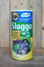 A canister of Sluggo slug and snail control product, featuring a blue, green, and yellow label with illustrations of snails, set against a rustic wooden background.
