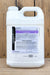 A large white plastic jug of BioWorks SUFFOIL-X with a detailed product label, set against a rustic wooden plank background.