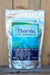A 3 lb bag of Thorvin For Animals organic kelp supplement, standing upright against a rustic wooden plank background.