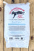 A white bag of Vermont Compost Company Fort Light compost, displayed flat on a rustic wooden plank background.